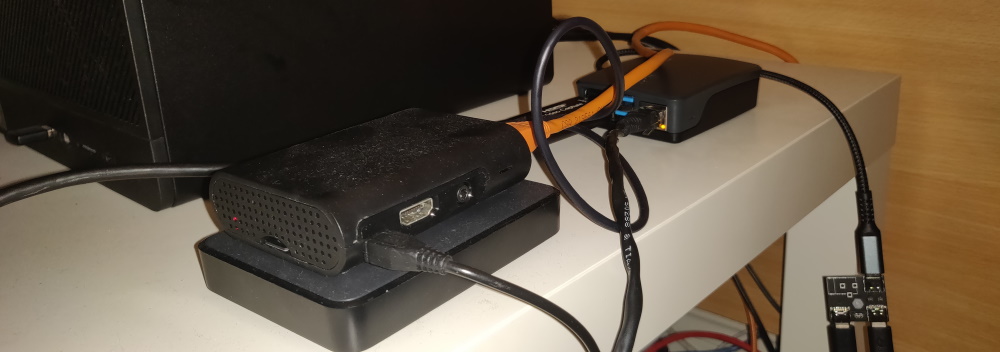 Photo of two Raspberry Pi's one with an external hard drive and one with power hanging over the edge (whoops)